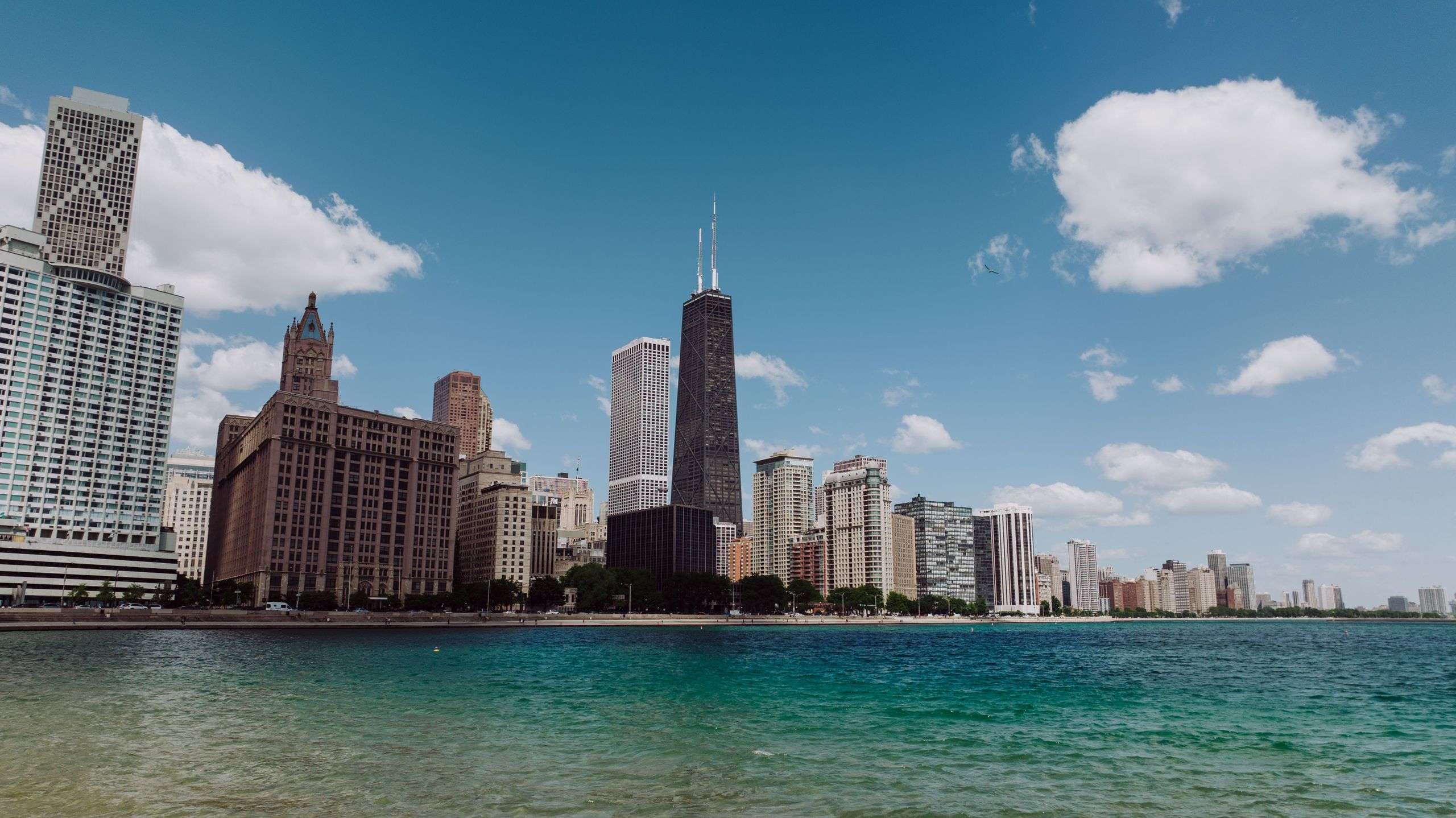 Stunning view of Chicago's skyline with Lake Michigan on a clear day featuring iconic skyscrapers.